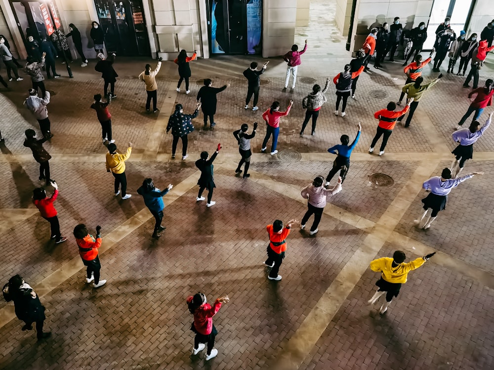 people walking on gray concrete floor