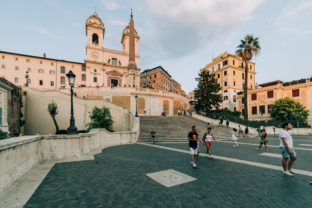 people walking on street near brown concrete building during daytime