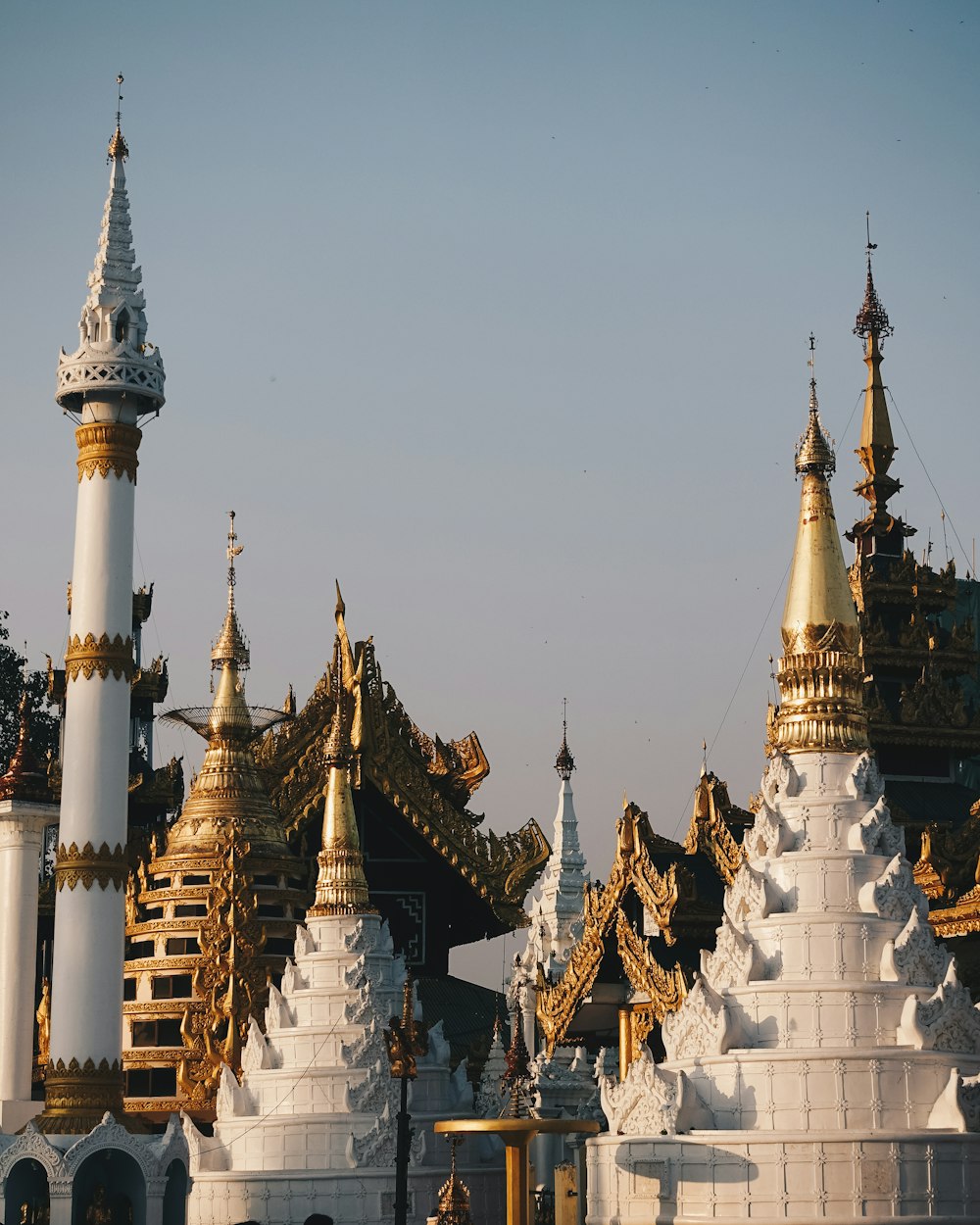 white and gold temple under white sky during daytime