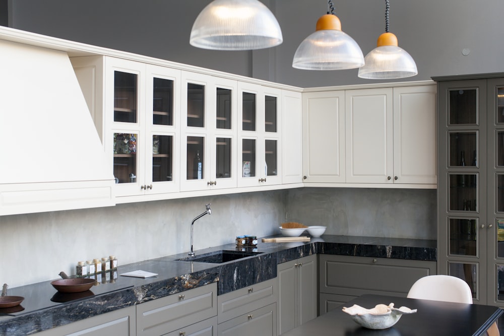 white pendant lamp turned on in kitchen