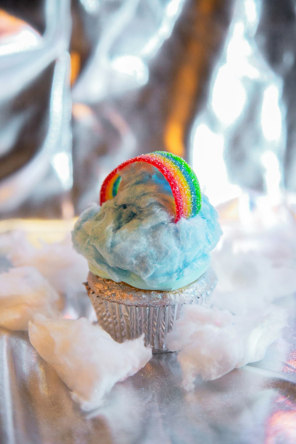 brown cupcake with white icing on top