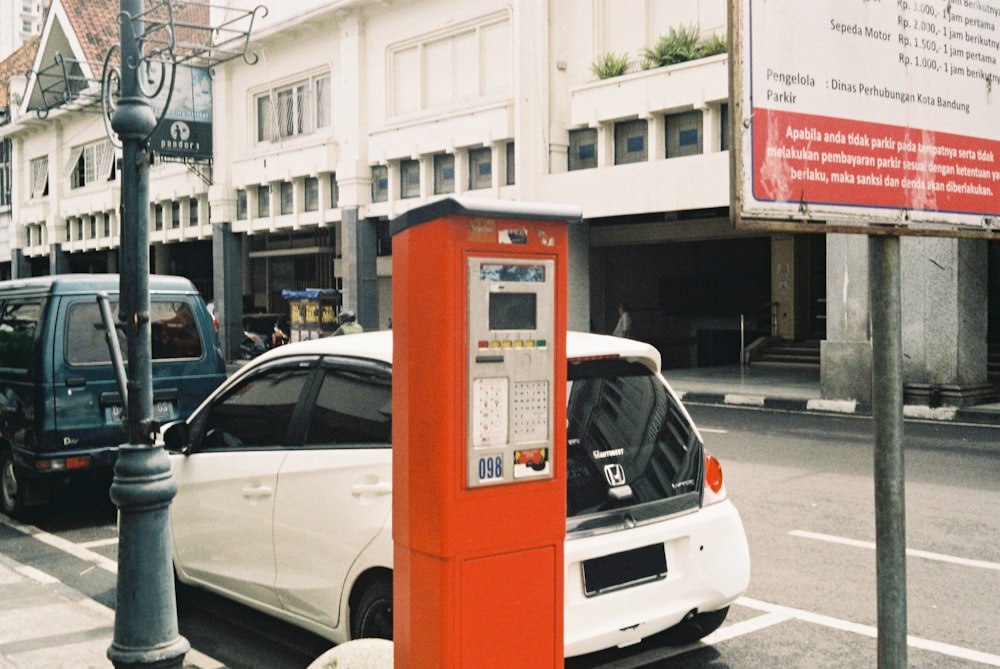 white and red car on road during daytime