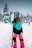 a woman holding a snowboard in the snow