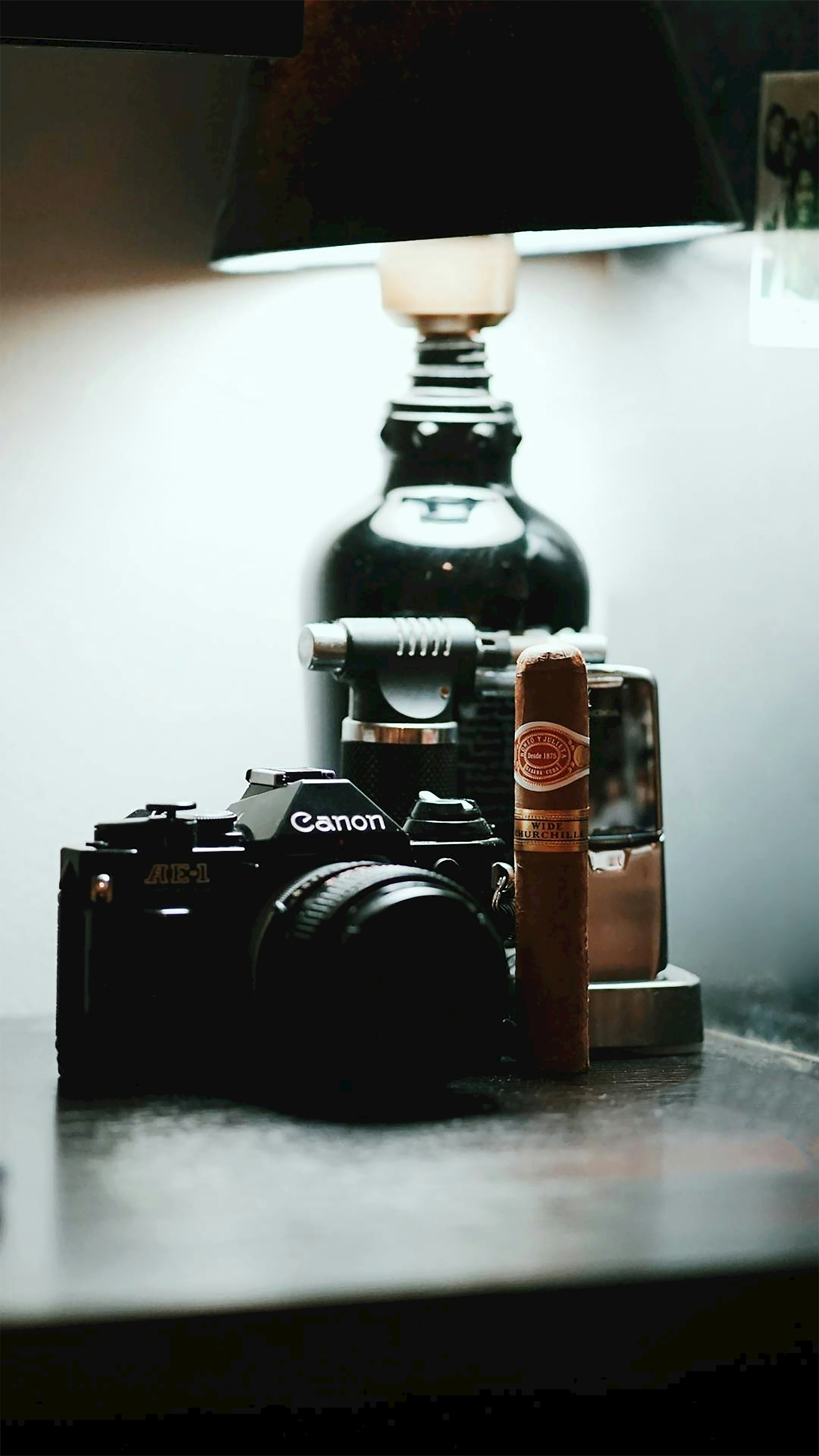 black nikon dslr camera on brown wooden table