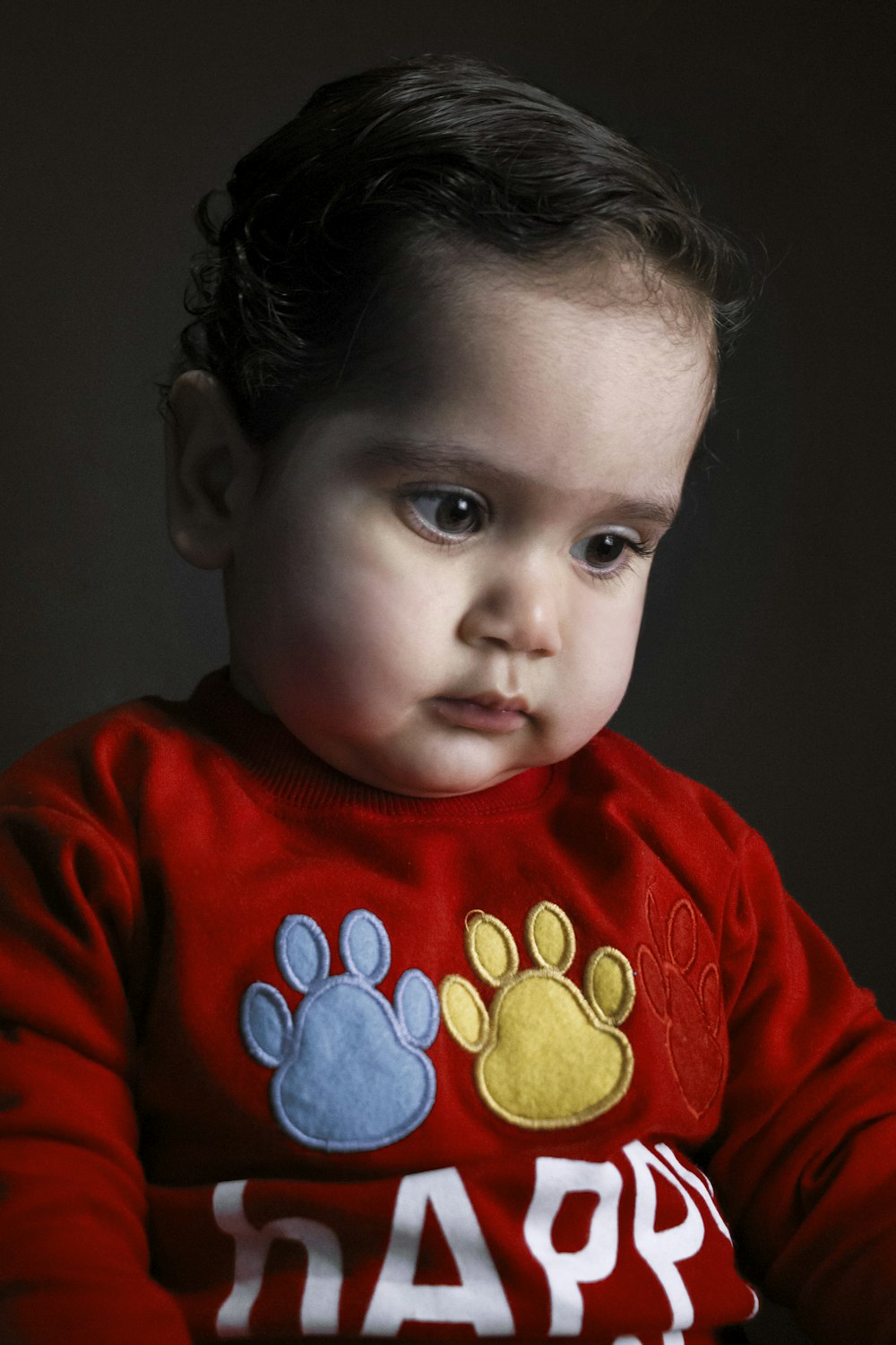 boy in red and blue crew neck long sleeve shirt