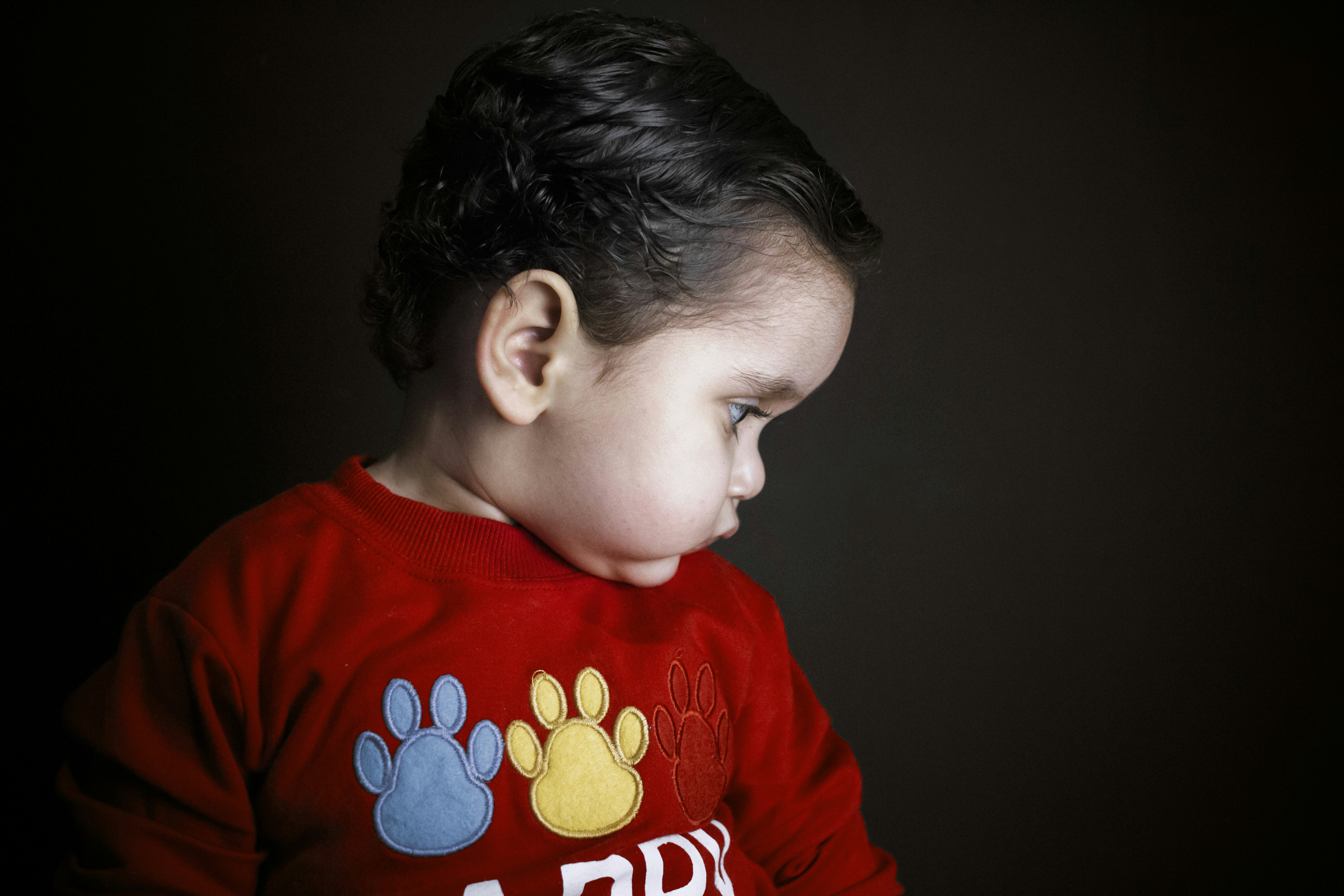 boy in red crew neck shirt