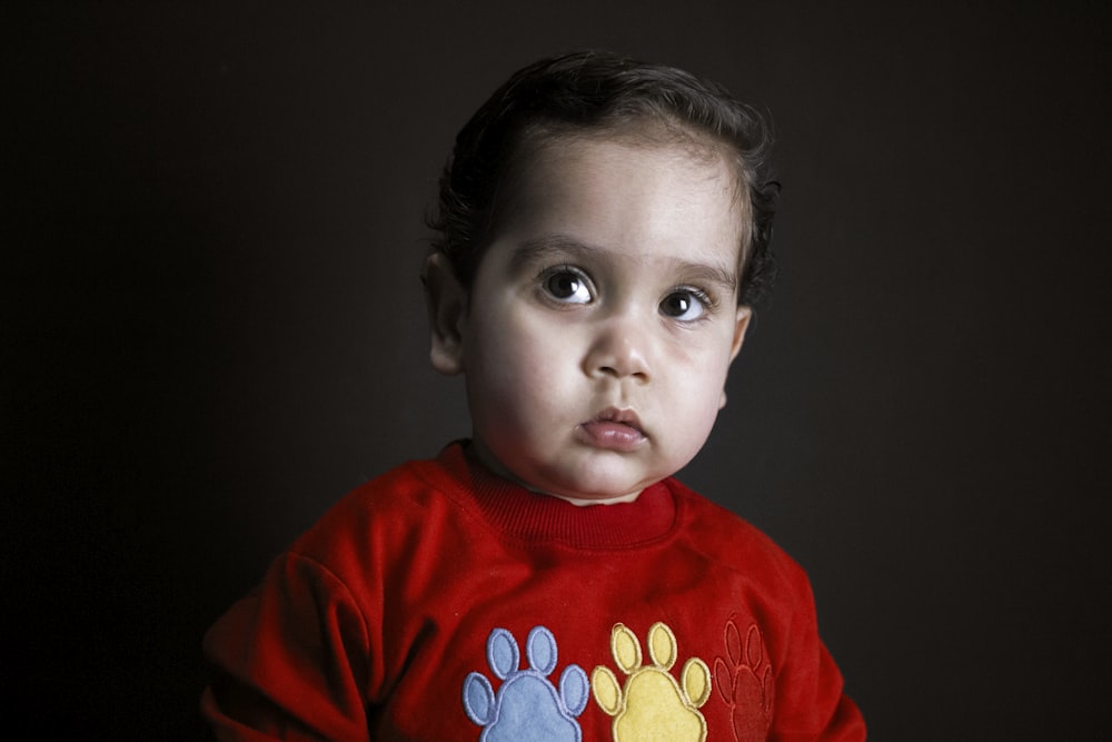 boy in red crew neck shirt