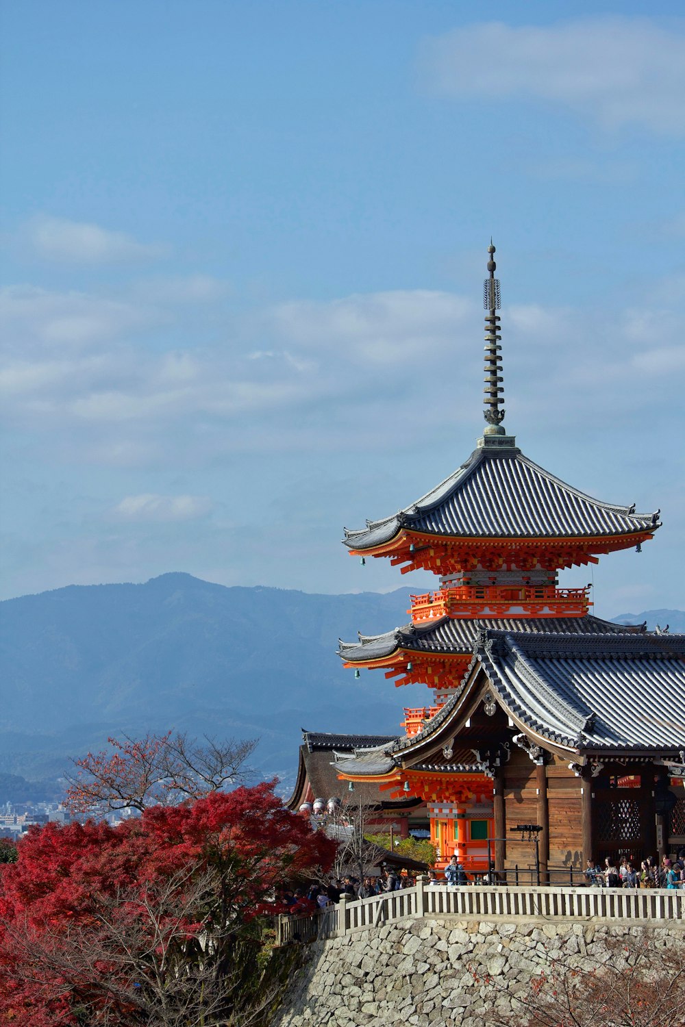 brown and white temple near trees during daytime