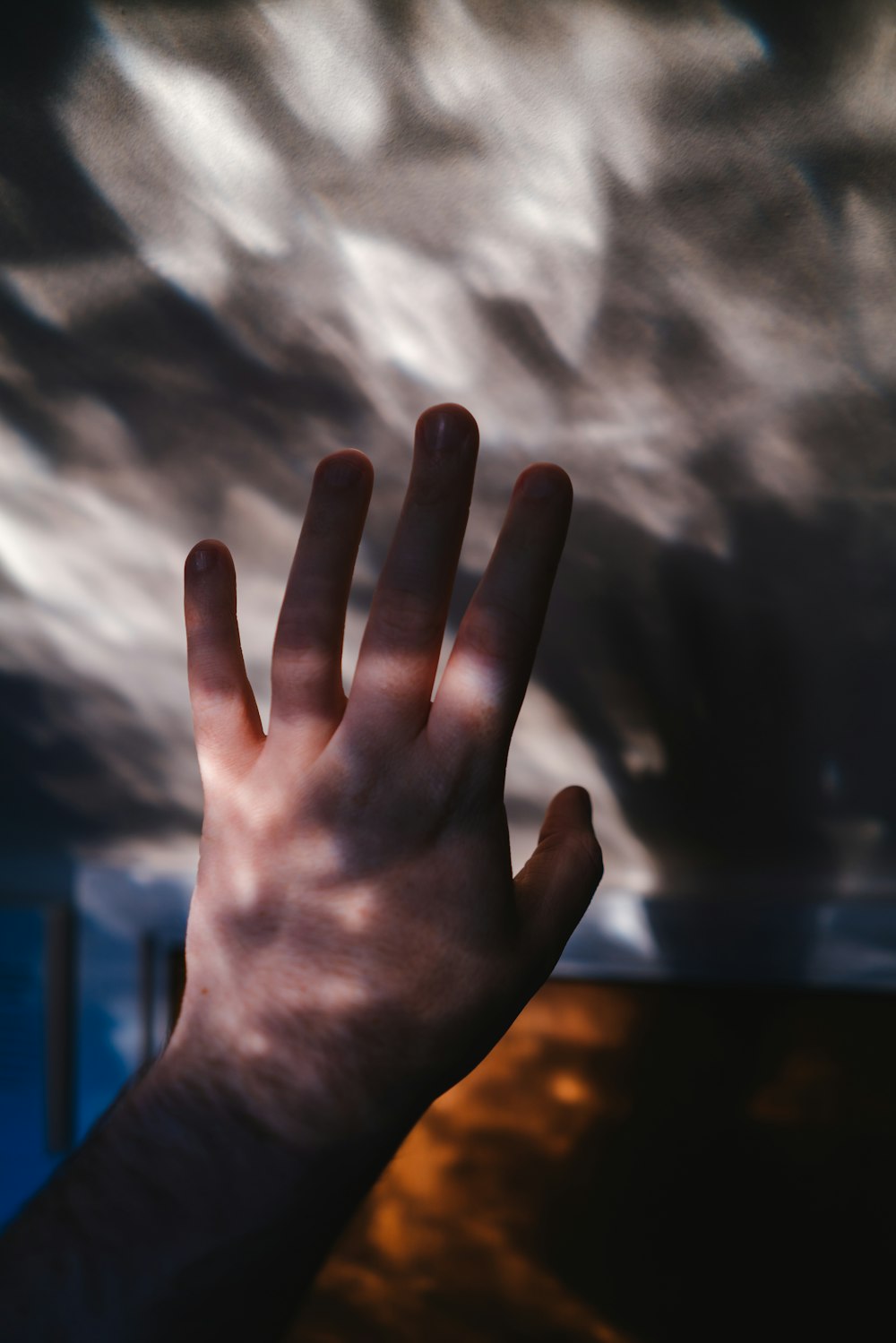 persons left hand under cloudy sky during daytime