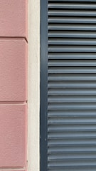 Close-up of smooth decorative plaster on a clean, modern British home exterior.