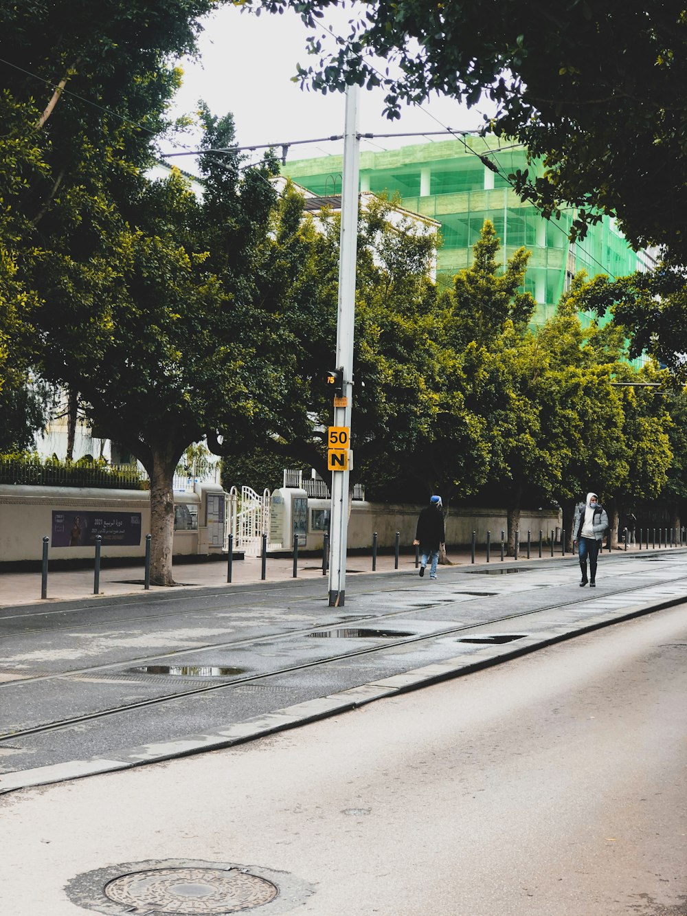 black traffic light on gray concrete road during daytime