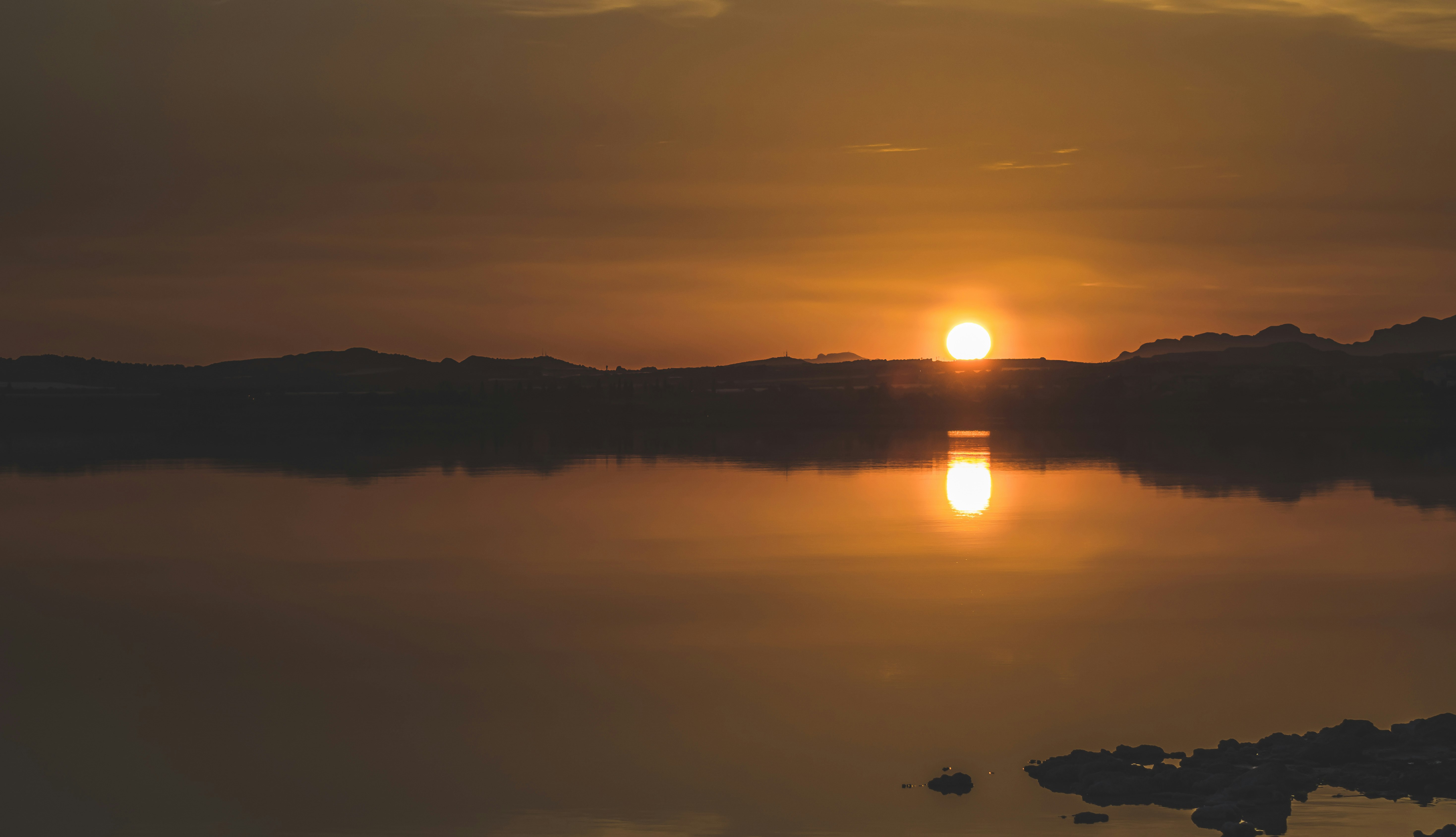 silhouette of mountains during sunset