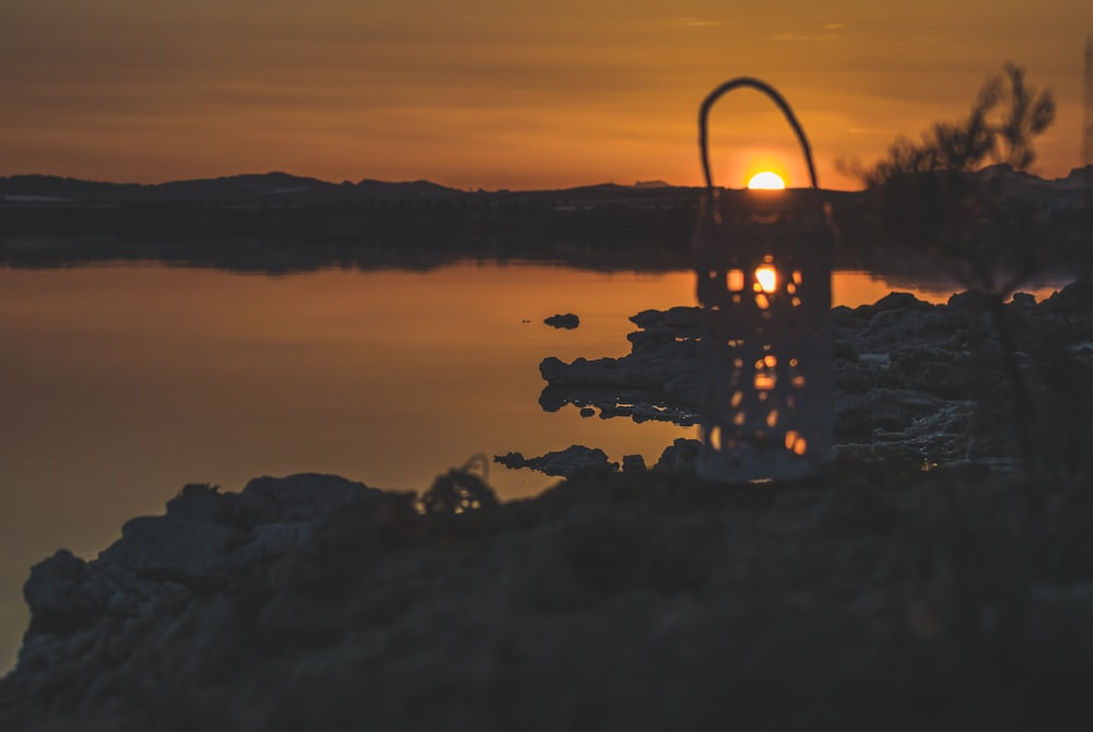 body of water during sunset