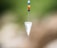 silver diamond pendant with red blue and yellow beads