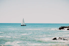 white sailboat on sea during daytime