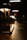 Close-up of decorative lamps casting warm light in a minimalist interior setting.