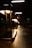 Close-up of decorative lamps casting warm light in a minimalist interior setting.