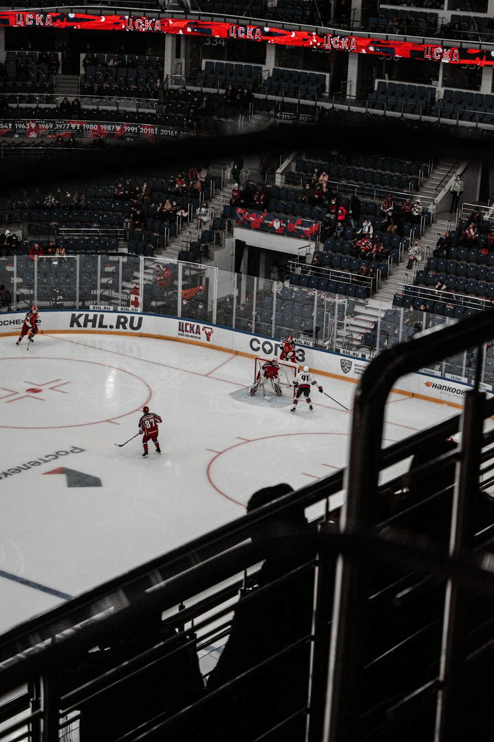 people playing ice hockey on ice hockey stadium