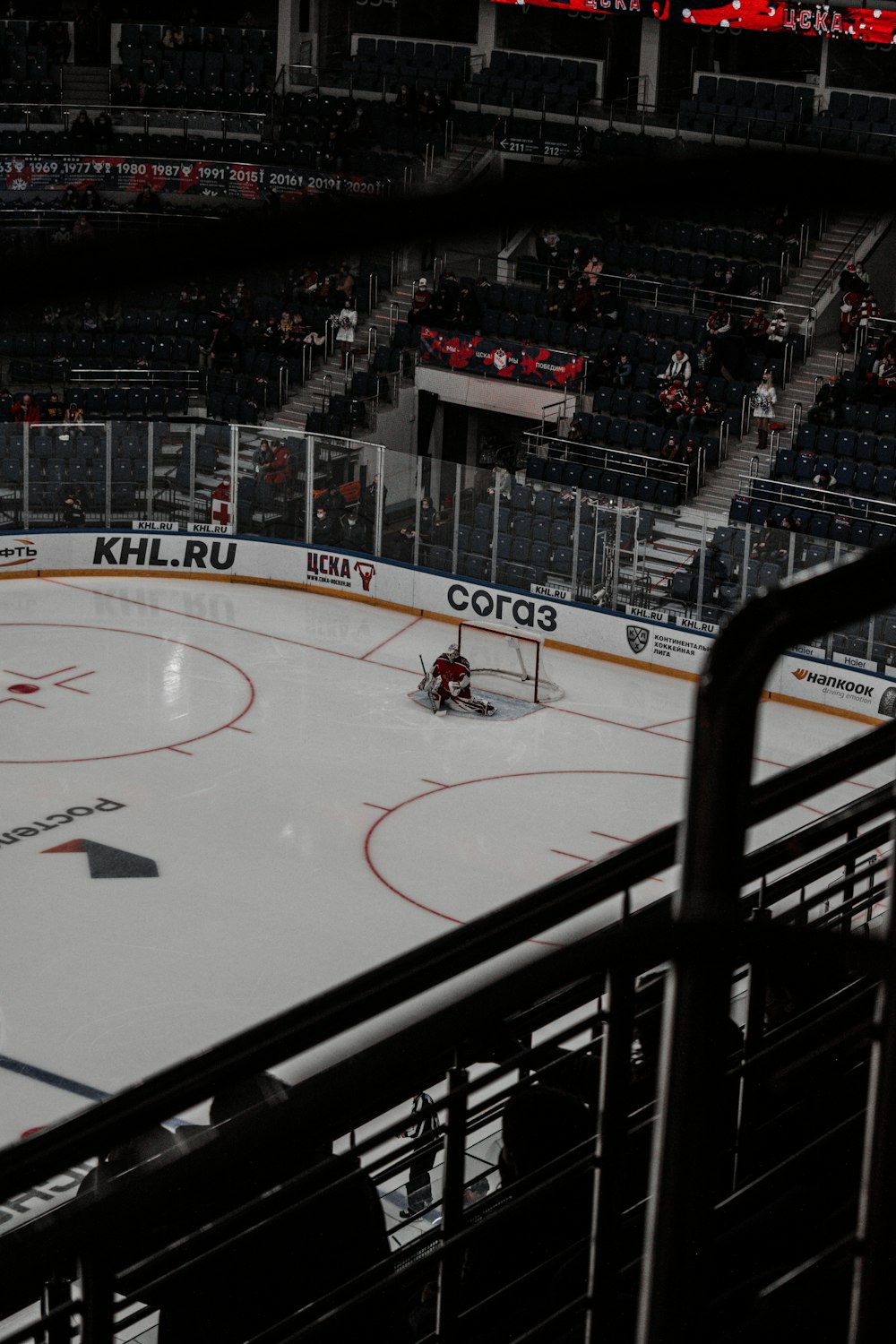 people playing ice hockey on ice hockey stadium