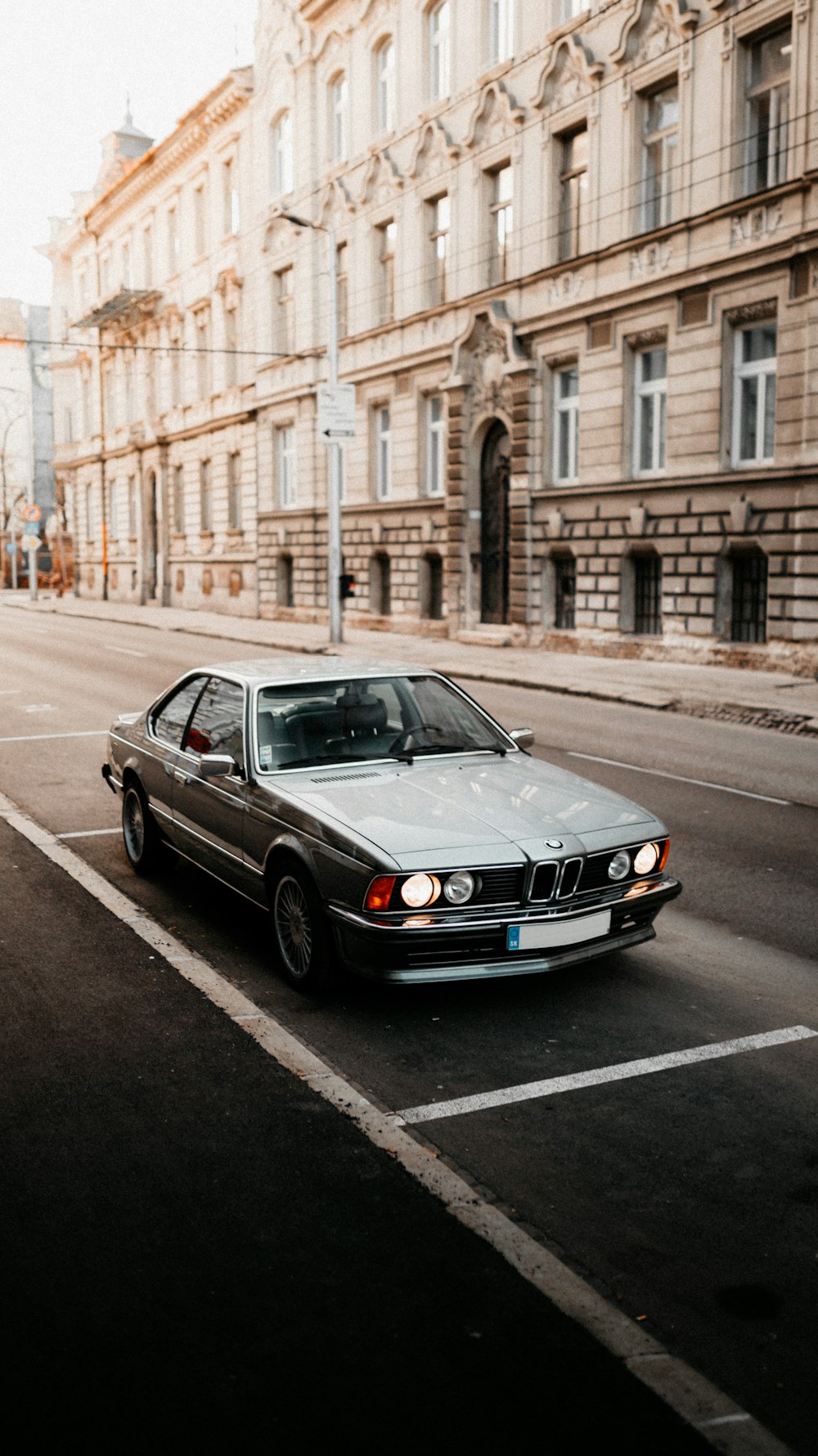 black mercedes benz coupe on road during daytime