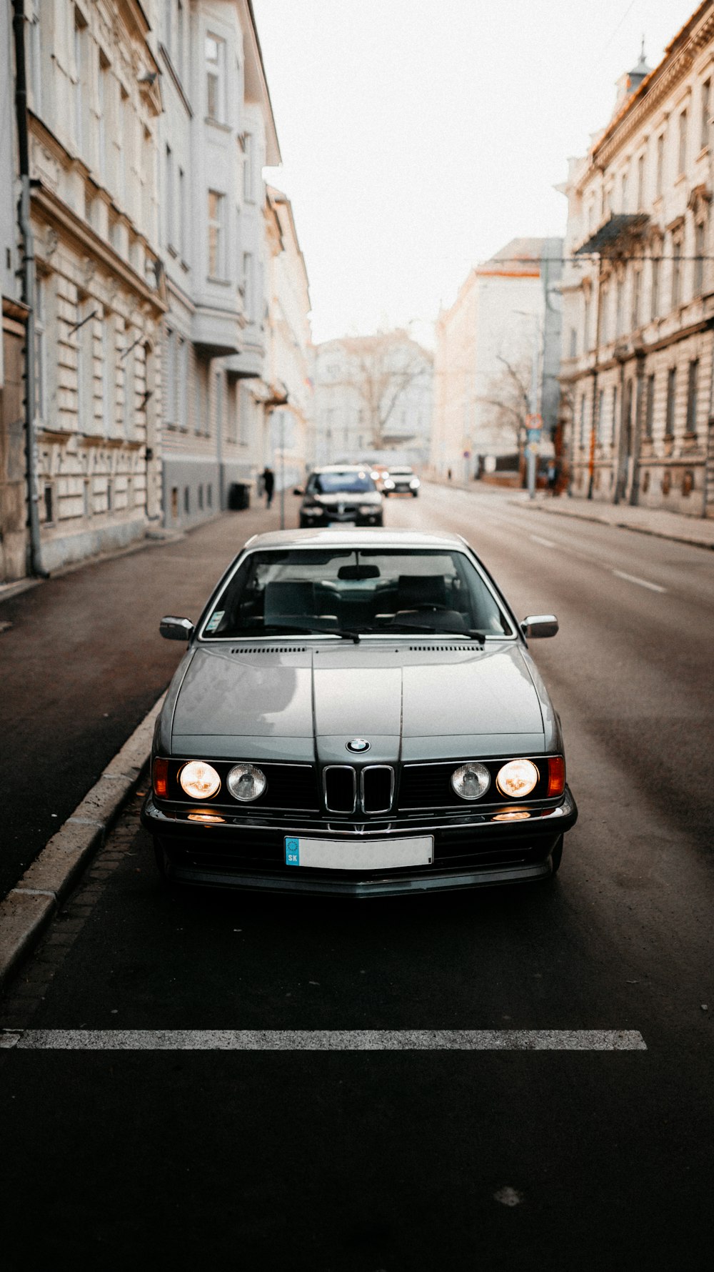 white mercedes benz car on road during daytime