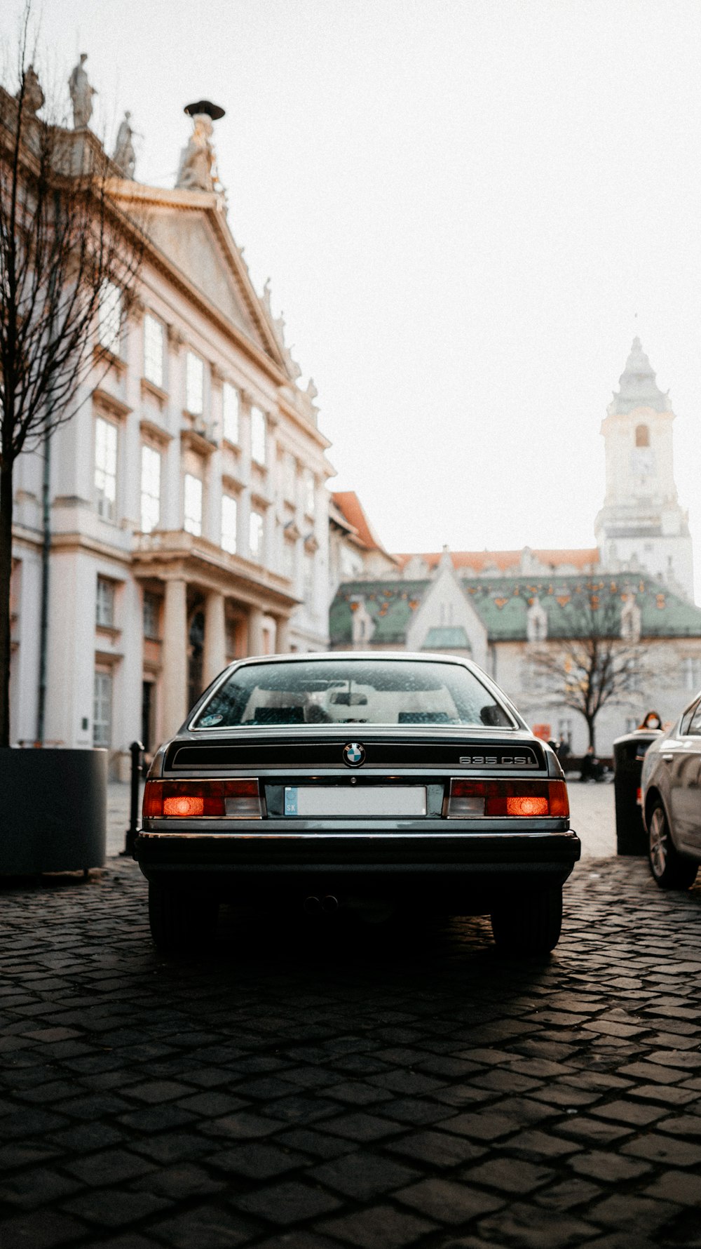 gray bmw car on road during daytime