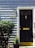 A black door with a golden mail slot and door knocker is set against a light blue wooden paneled wall. The house number, 1234, is displayed prominently in gold. A classic outdoor lantern is mounted on the wall next to the door. Green shrubs and a small potted plant decorate the entrance.
