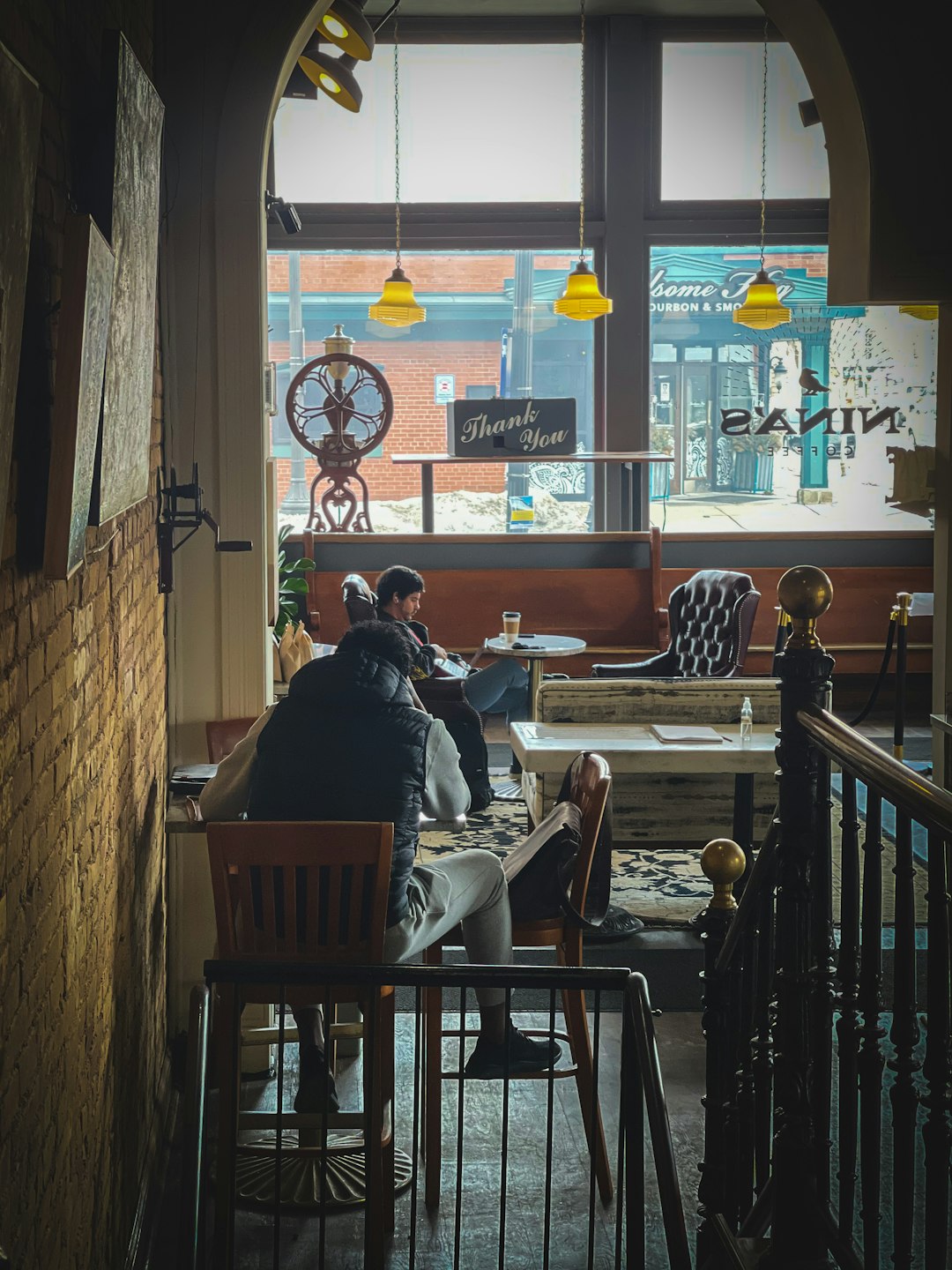 man and woman sitting on chair in restaurant