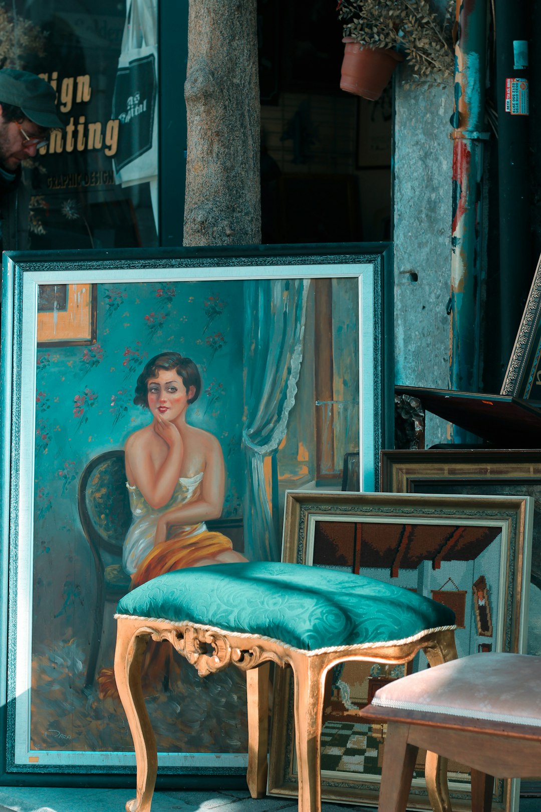 topless man sitting on brown wooden framed brown padded armchair