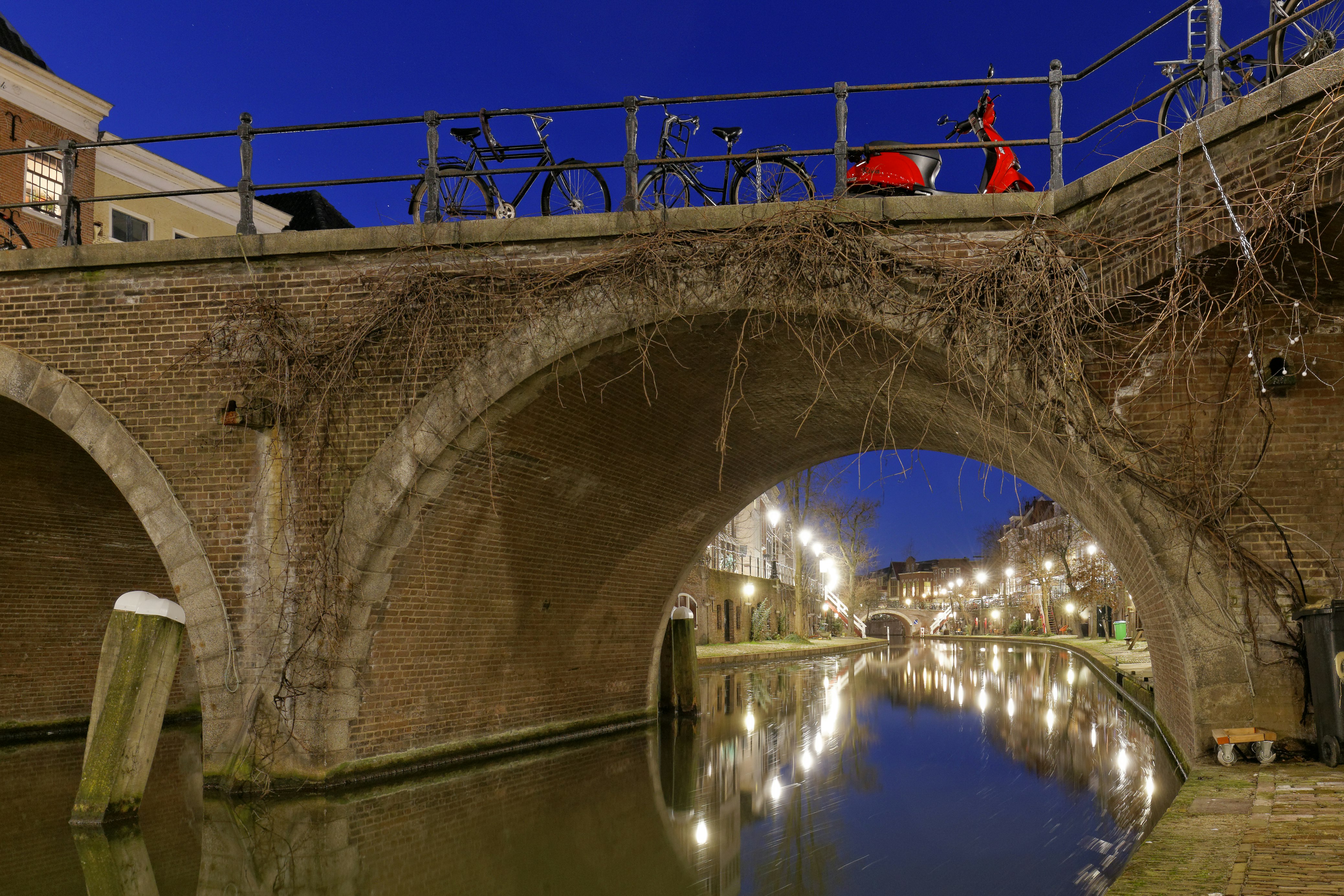 brown concrete bridge over river during daytime