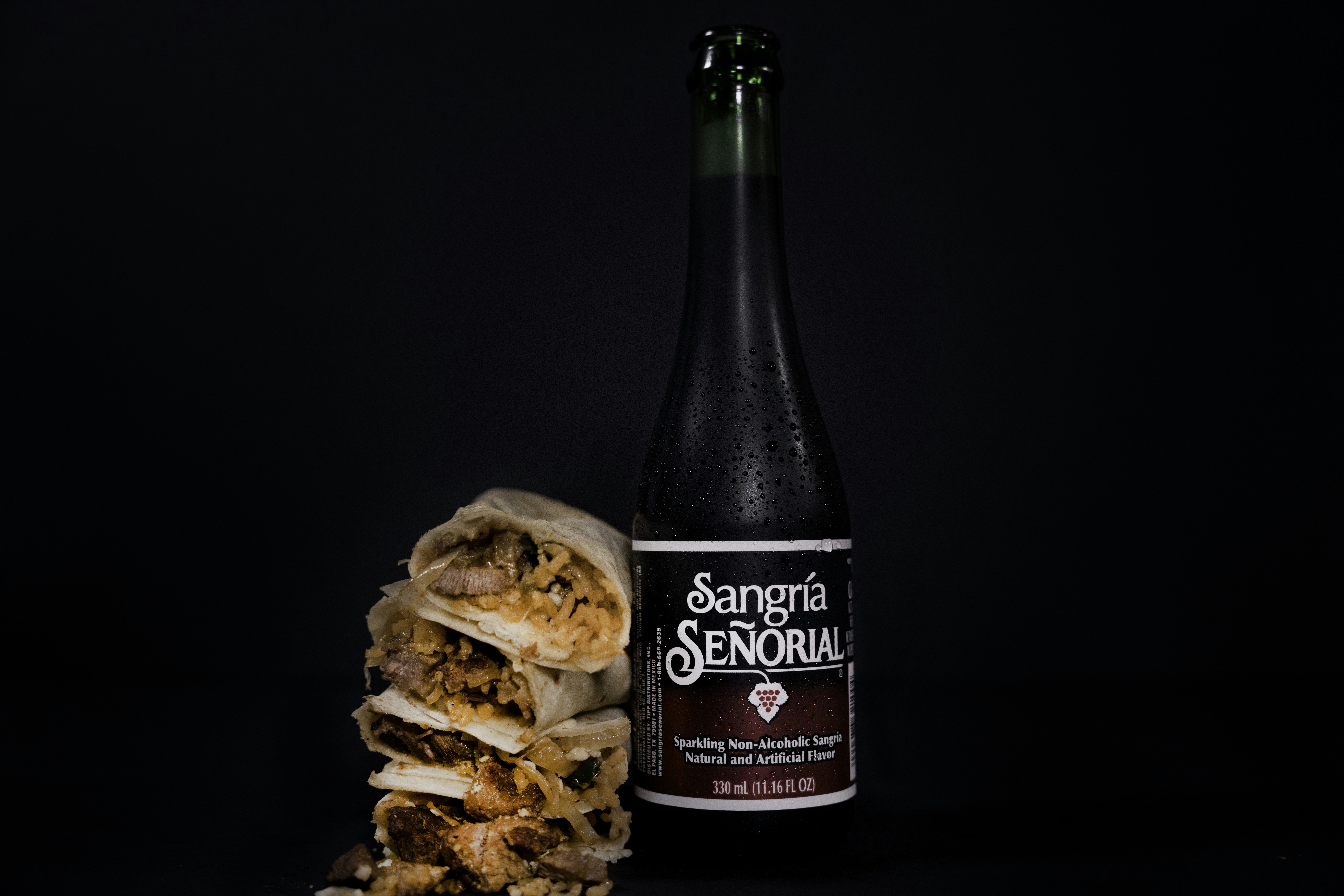 black and brown labeled bottle