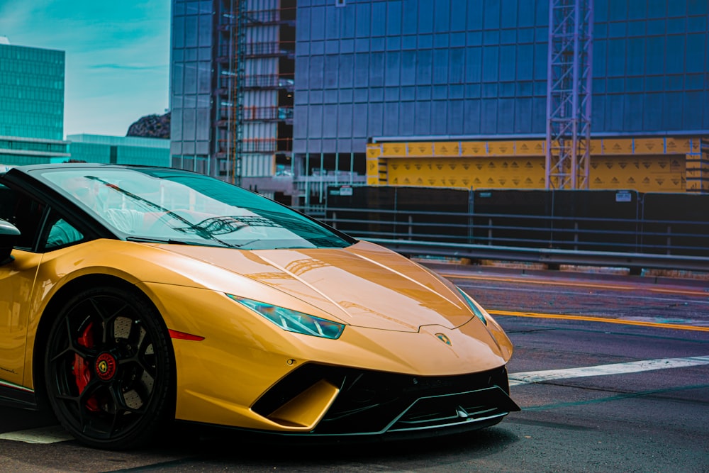 yellow lamborghini aventador on road during daytime