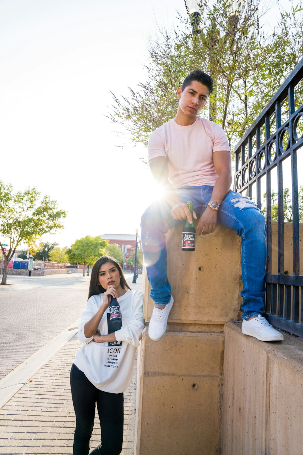 man in white crew neck t-shirt sitting beside woman in white crew neck t-shirt