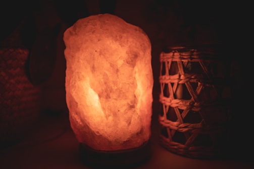 Artisan salt lamps glowing warmly in a cozy room.