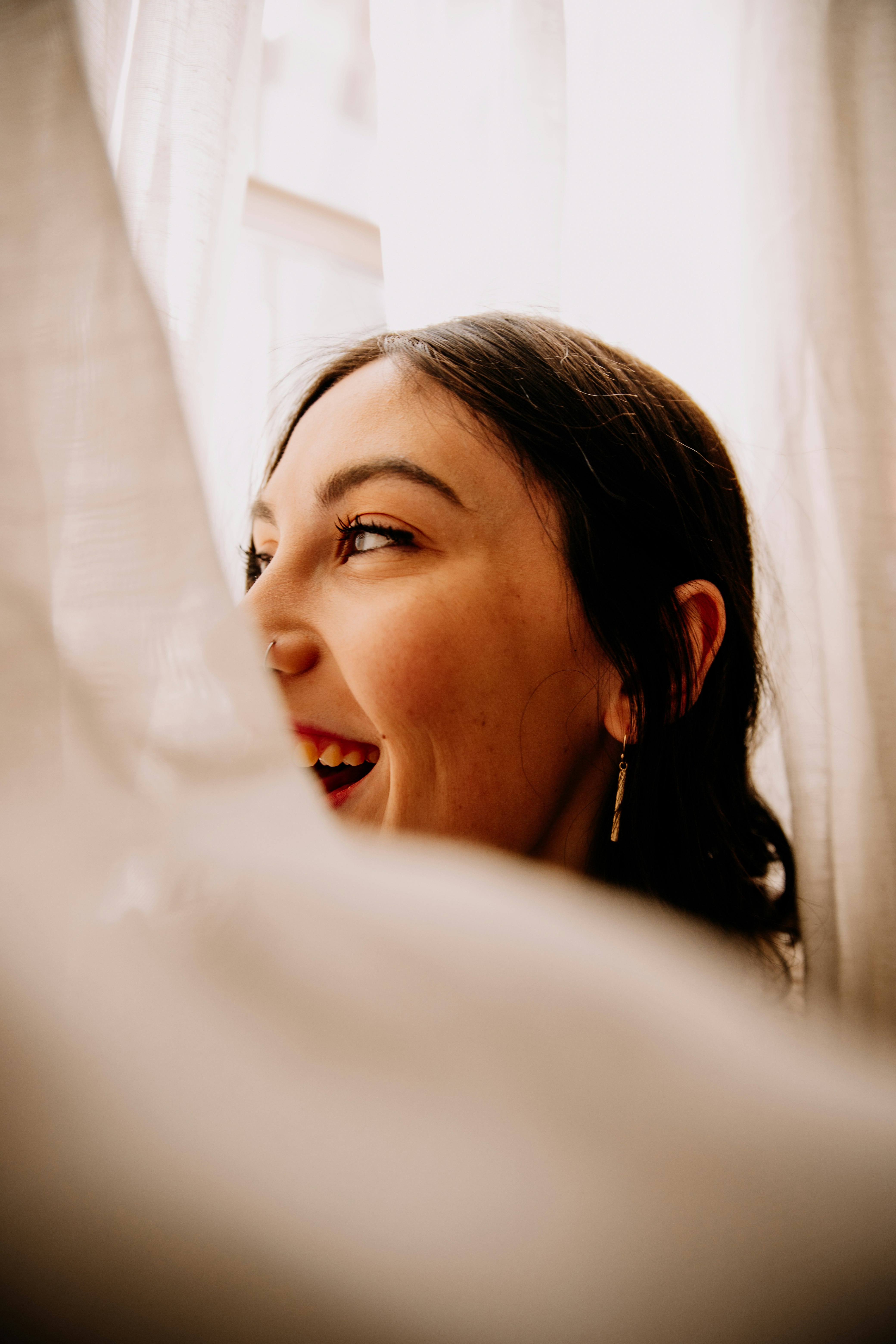 woman in white shirt smiling