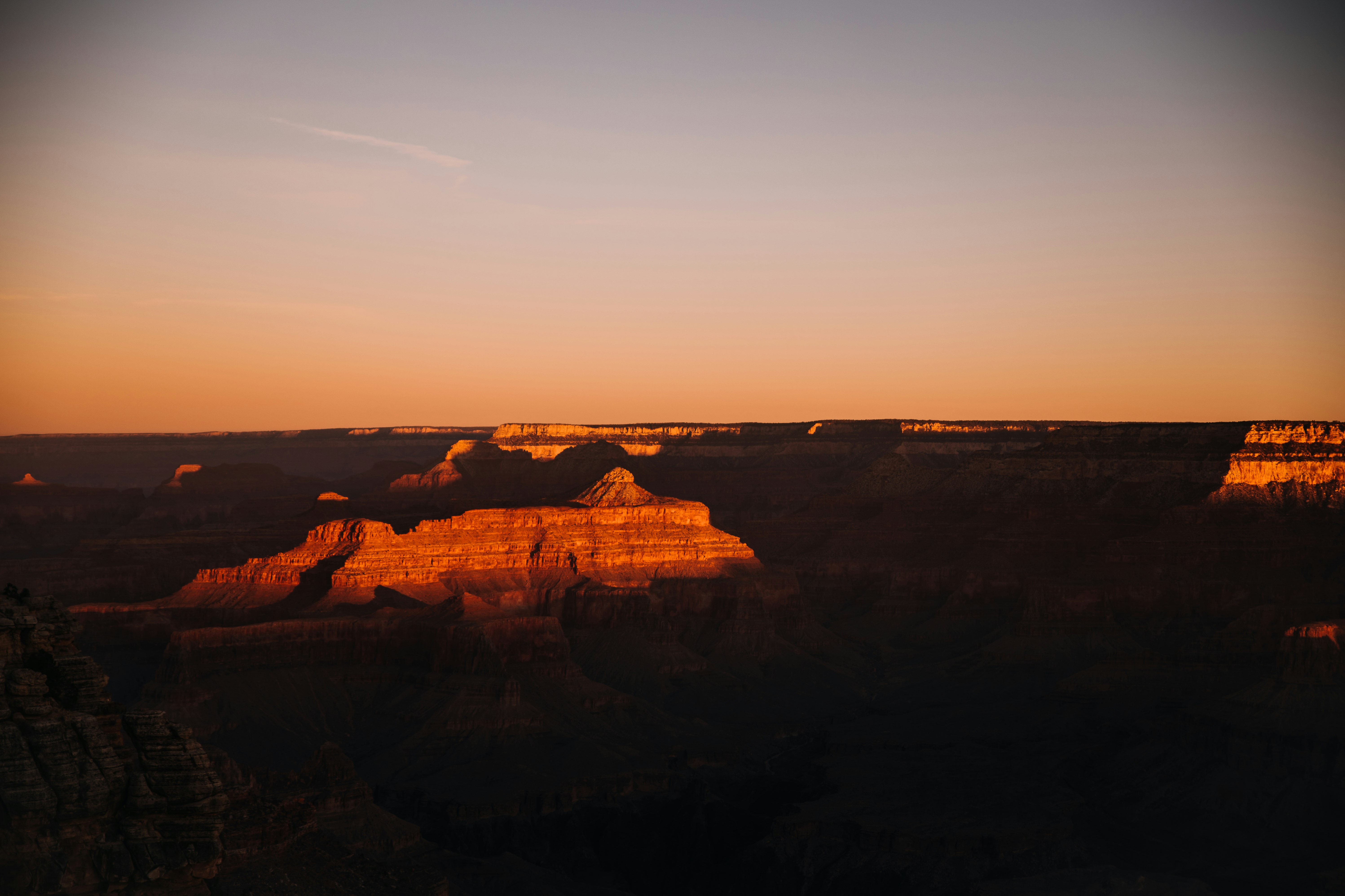 brown rock formation during sunset