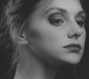 An elegant pencil portrait capturing a thoughtful expression with fine lines.