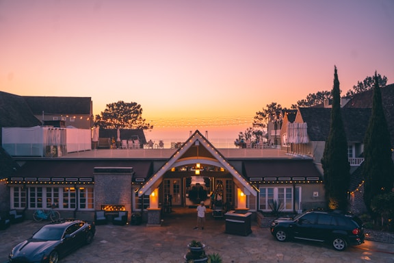 A welcoming luxury villa entrance with elegant lighting at dusk in Kuwait.