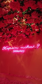 A colorful congratulatory flower board displayed outside a wedding venue in Jogja.