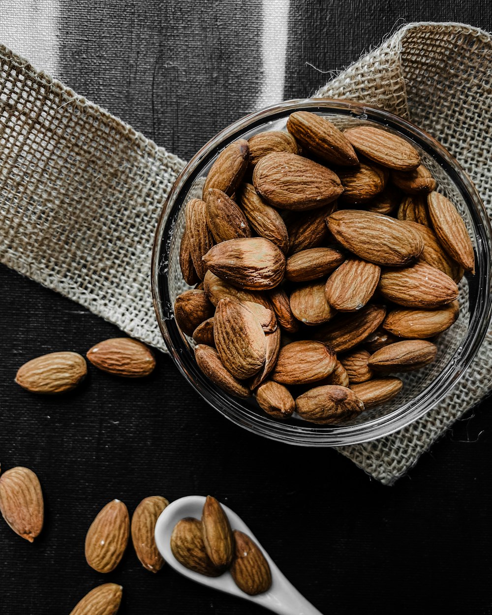 brown almond nuts on stainless steel bowl