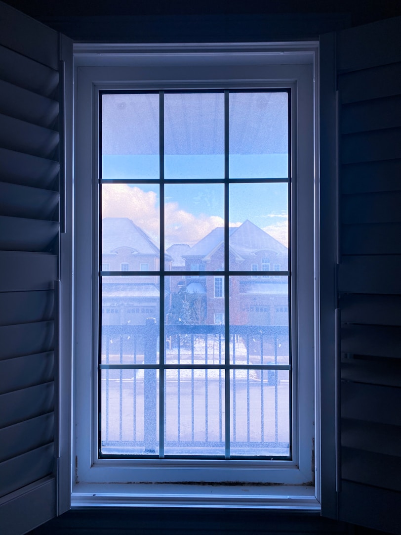 white wooden framed glass window