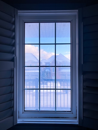 white wooden framed glass window