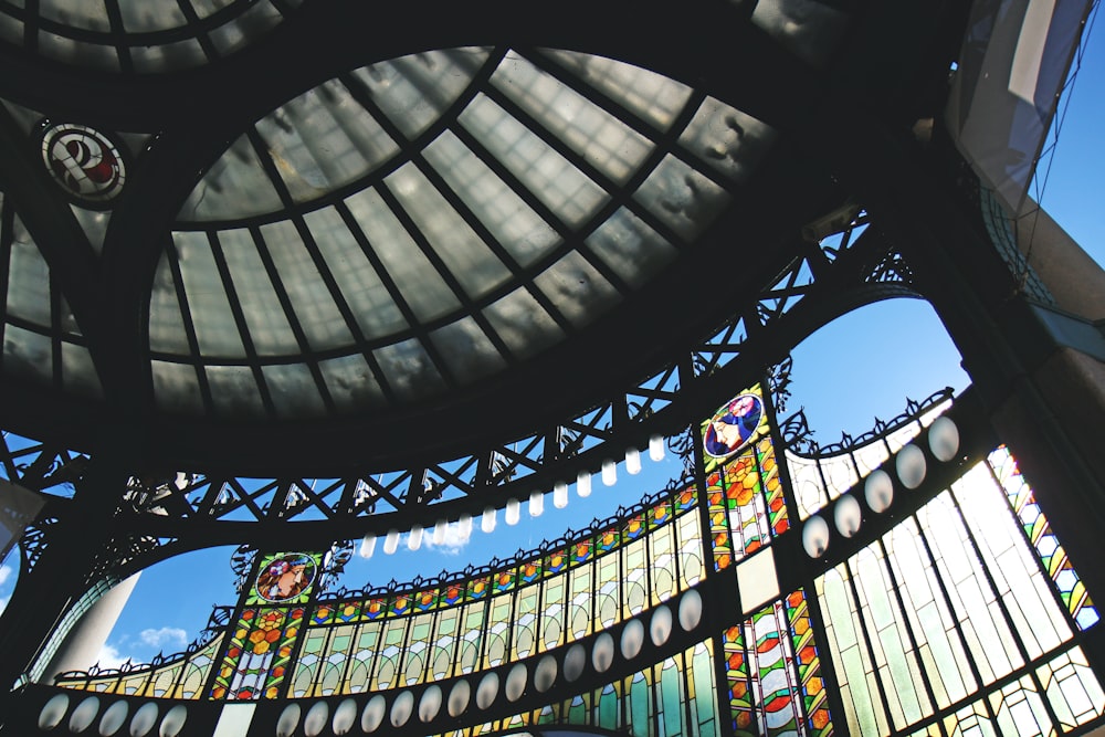 low angle photography of glass ceiling