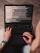 person using black laptop computer