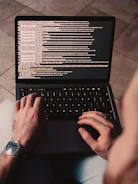 person using black laptop computer