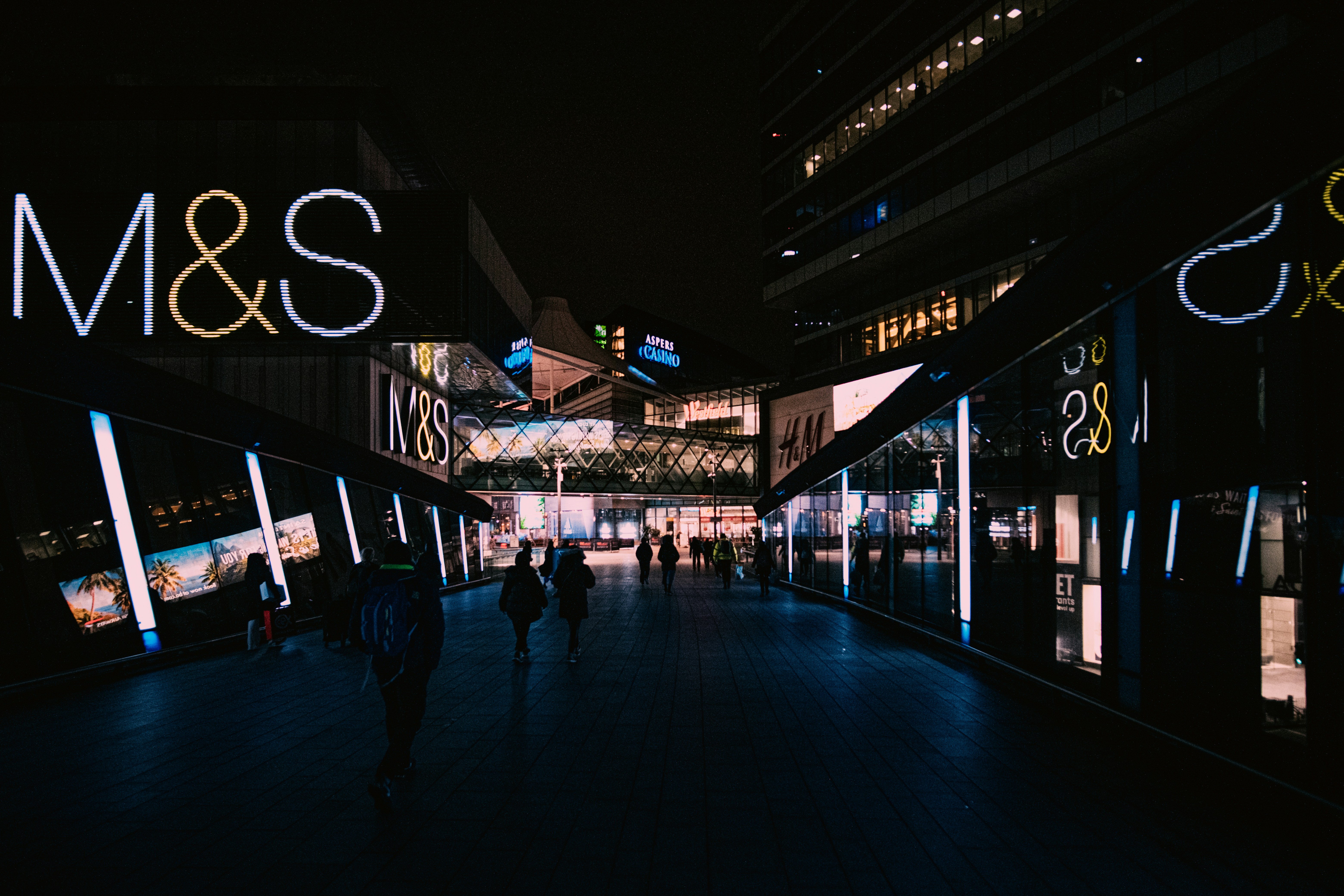 people walking on street during night time
