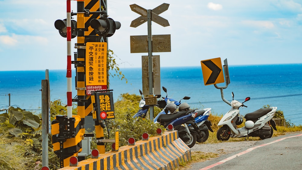 black and yellow street sign near body of water during daytime