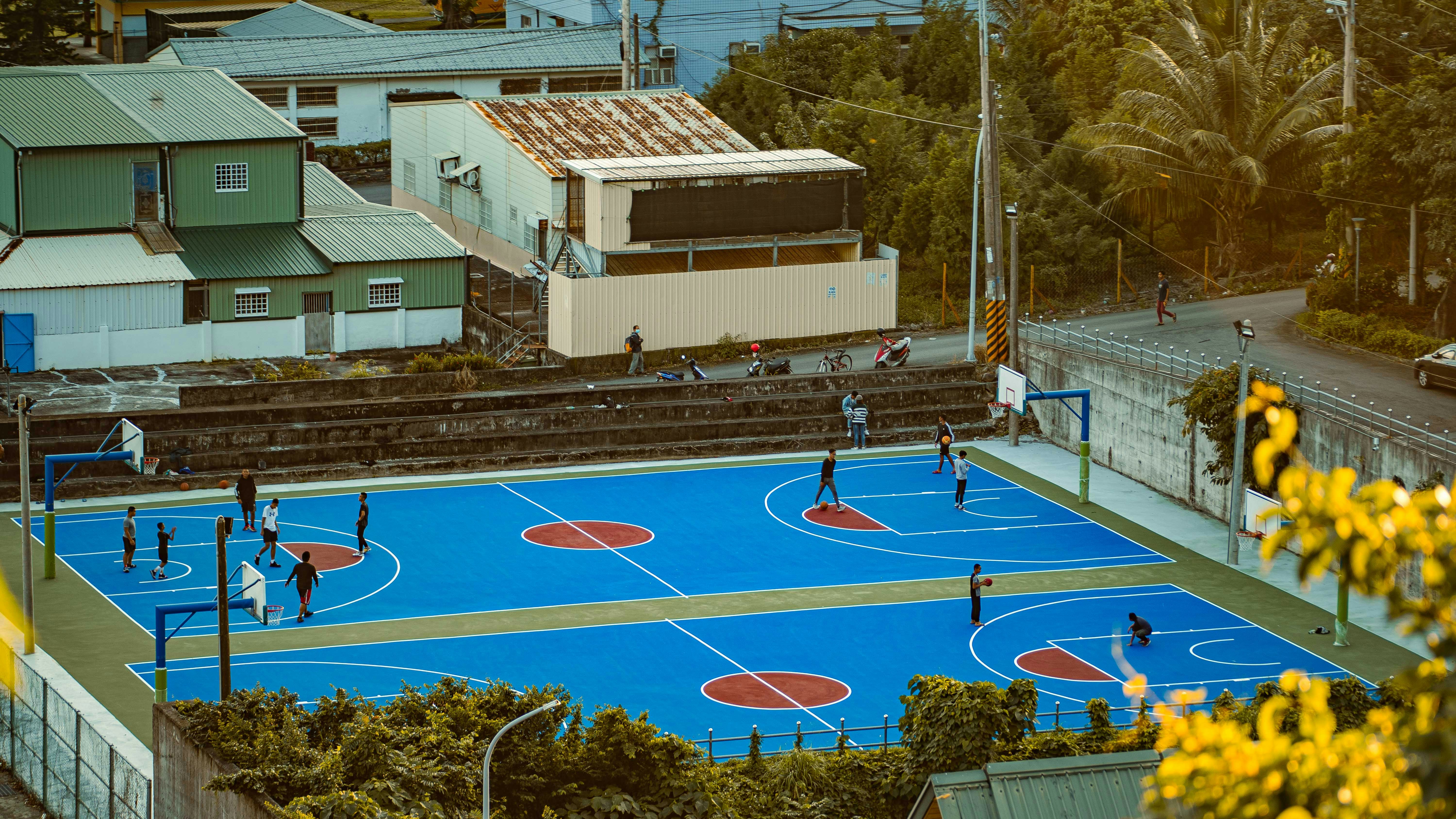 people playing basketball on basketball court during daytime, 