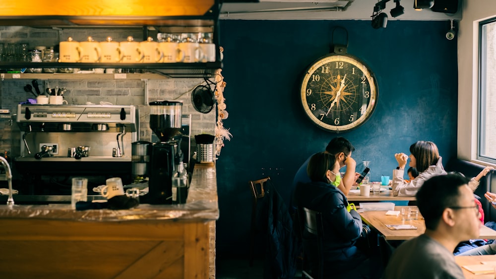 woman in blue shirt sitting on black chair