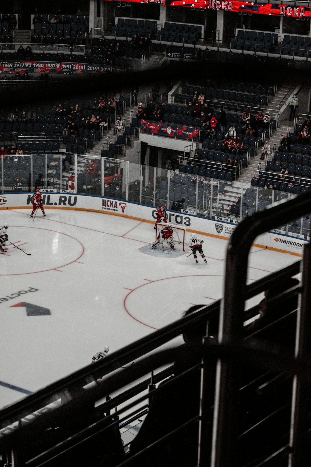 people playing ice hockey on ice stadium